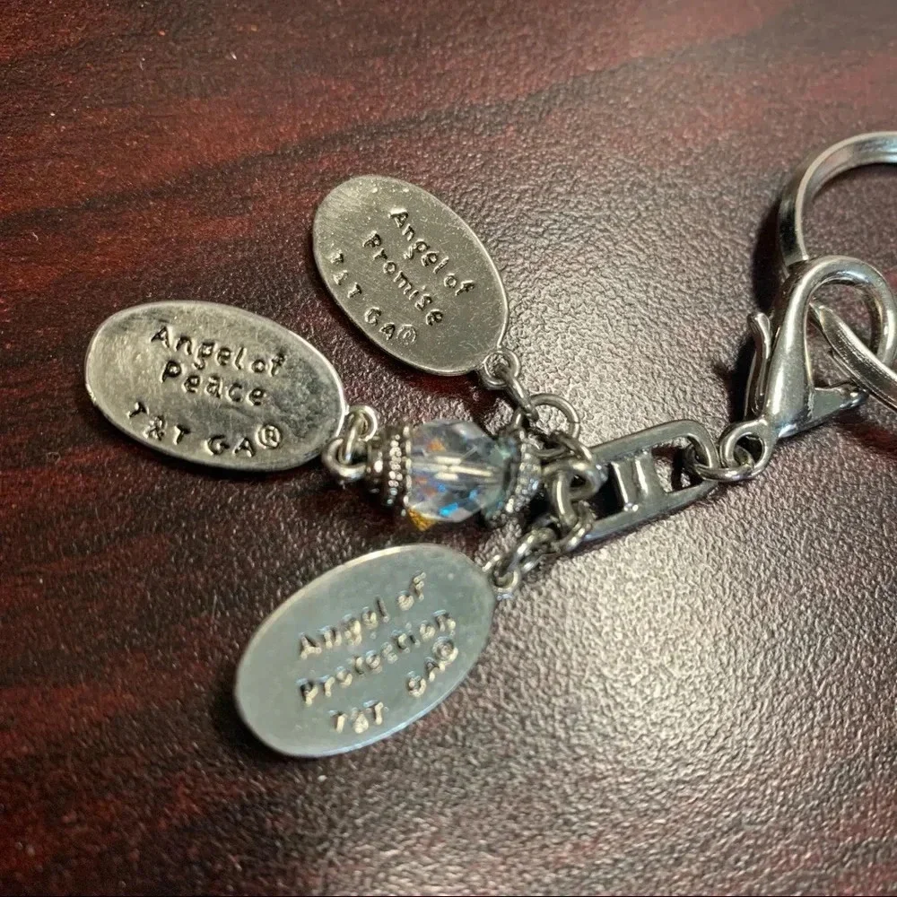 Avon trinity of angels key chain silver tone 4 inches long